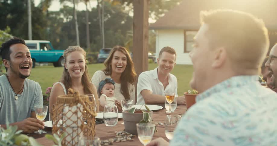 A group of people are having drinks outside
