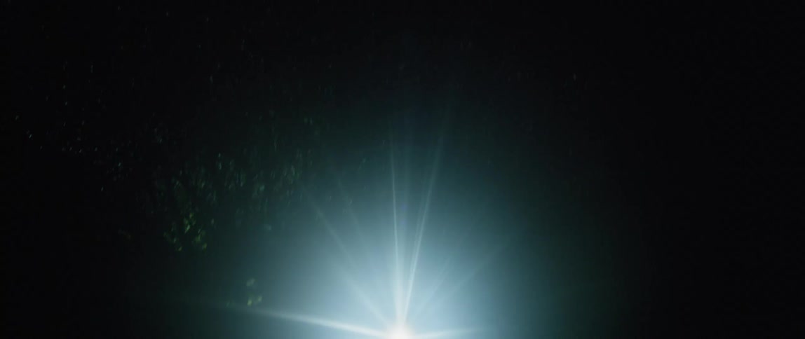 A bright light is shining in the dark