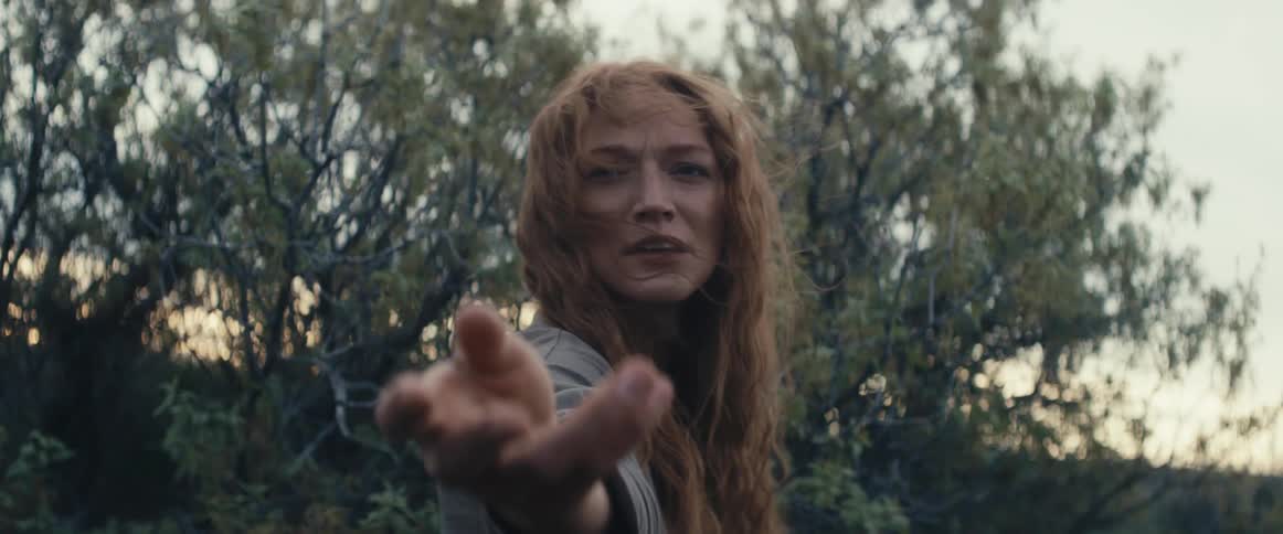 A woman reaches her hand out