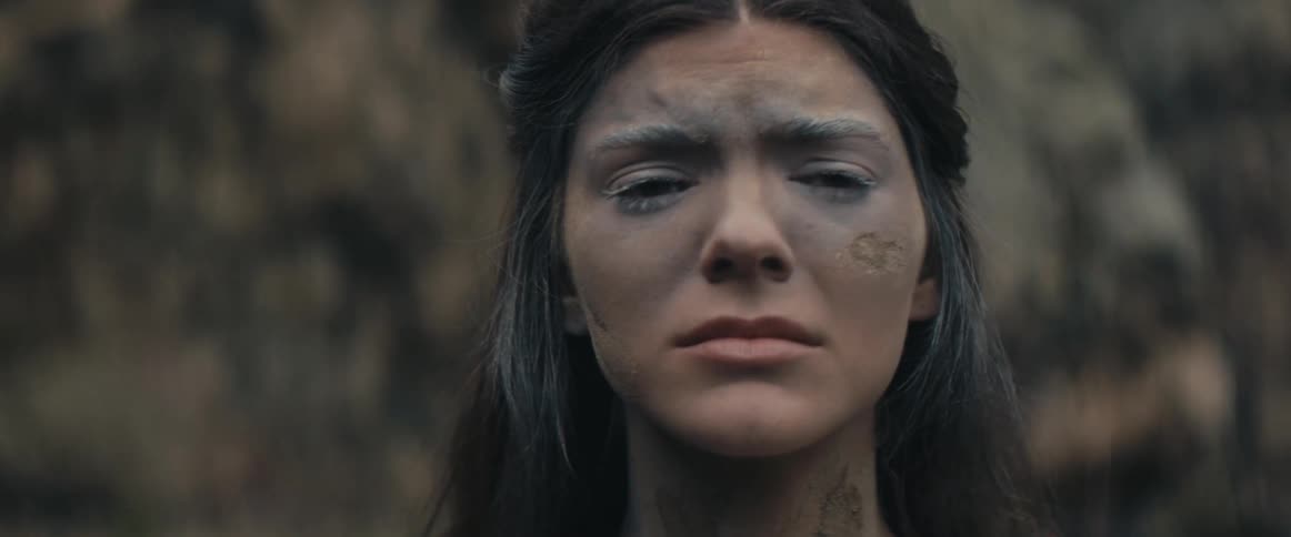 A woman outdoors crying