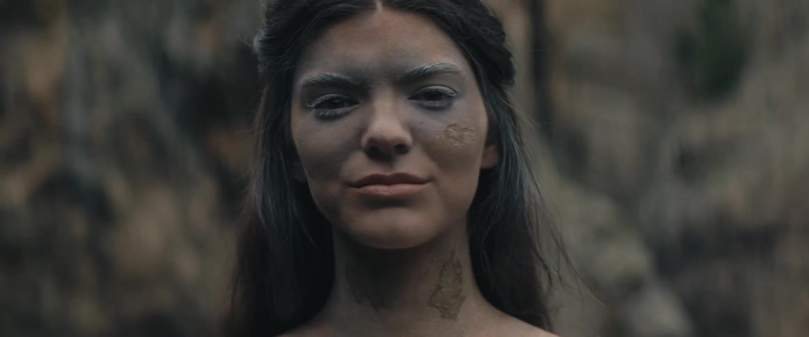 A woman is smiling outside