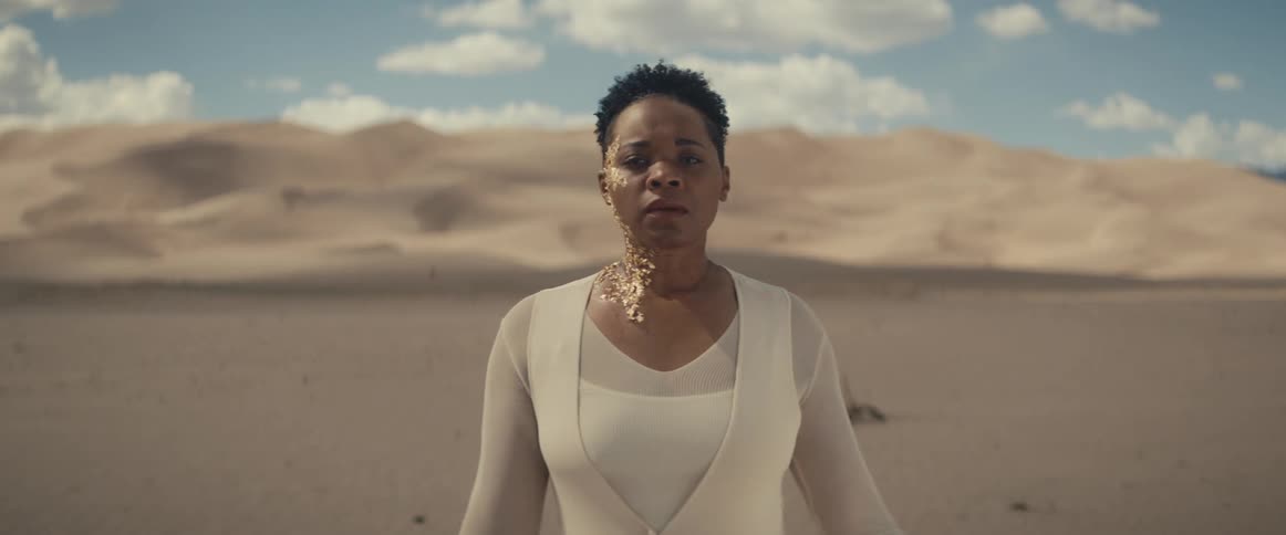 A portrait of a woman standing outdoors