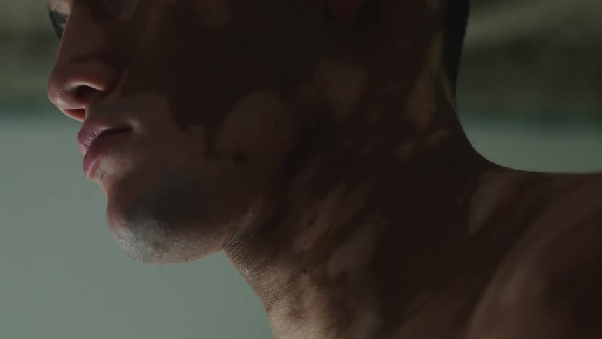 A man stands in the room alone