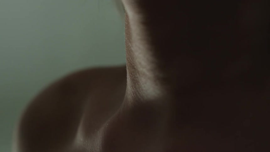 Close up of female models throat and chest in studio