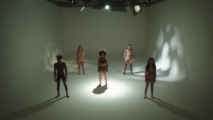 A group of people are standing in a room together