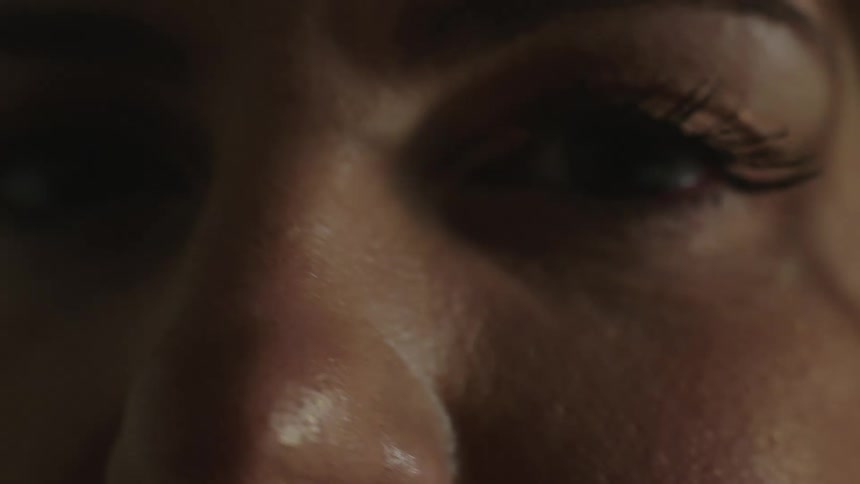 A close up of a womans blinking eye