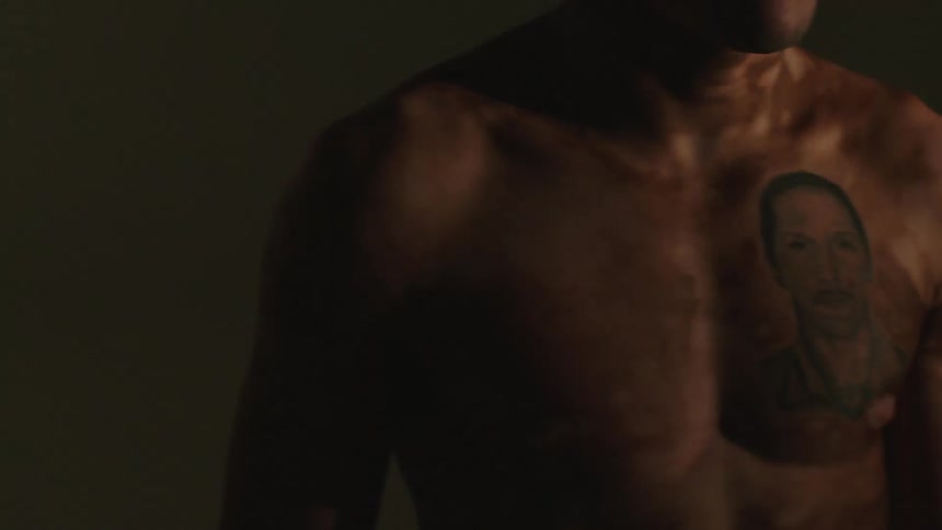 A man with vitiligo skin is revealed by flashing lights