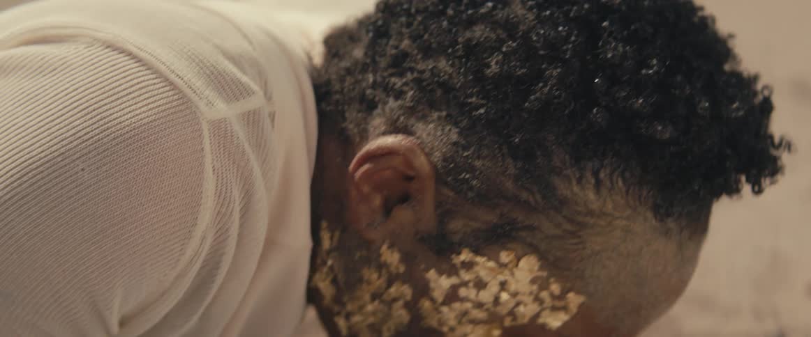 A woman screams as she wakes up and stands up in the desert