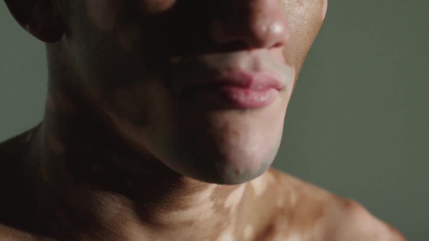 Close up view of a mans face is displayed