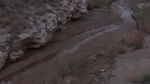 A stream of water flows down a hillside