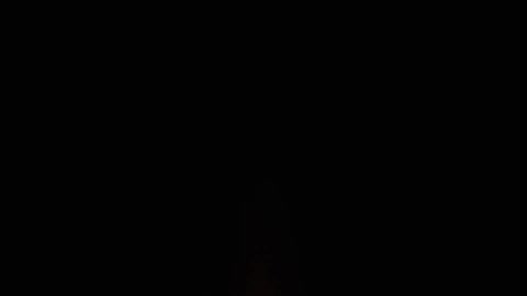 A fire sparking against a dark night