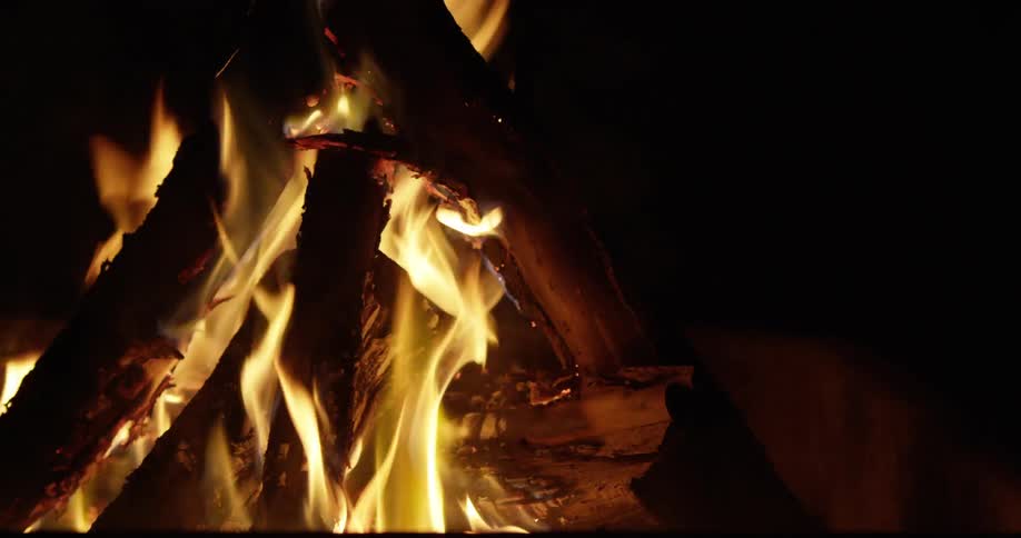 Close view of a blazing, nighttime campfire