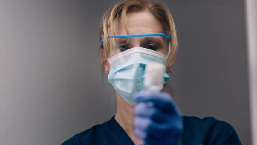 Nurse fills a syringe