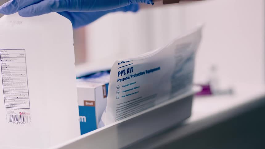 Nurse prepares vaccine for patient