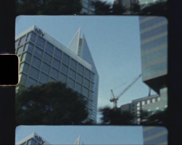 Skyscrapers and a crane in a large city in the daytime