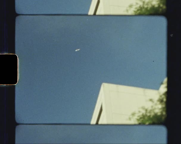 An airplane flying overhead on a clear day