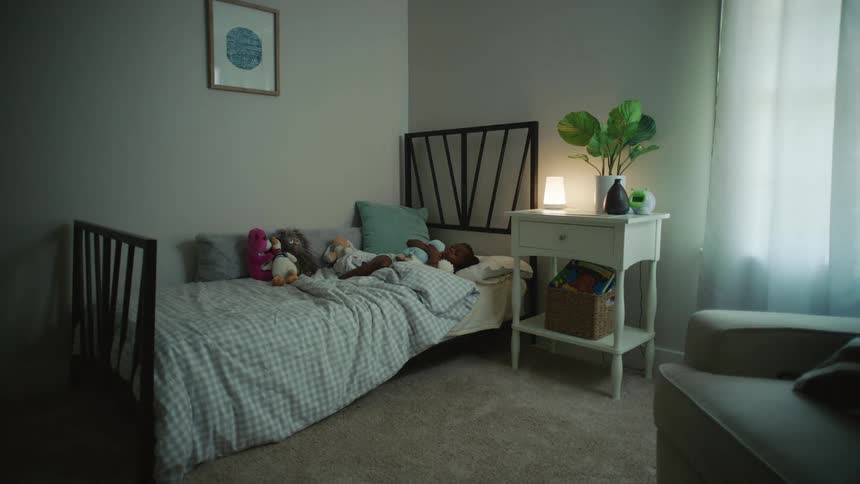 Black kid sleeping at its bed on its bedroom
