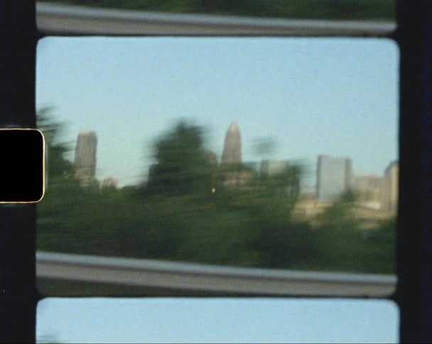 The tall buildings line the city ahead