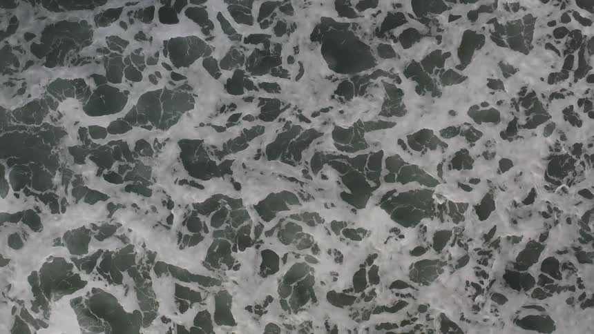 The waves crash on the shore