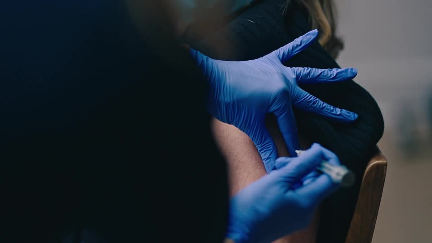 Nurse gives vaccine