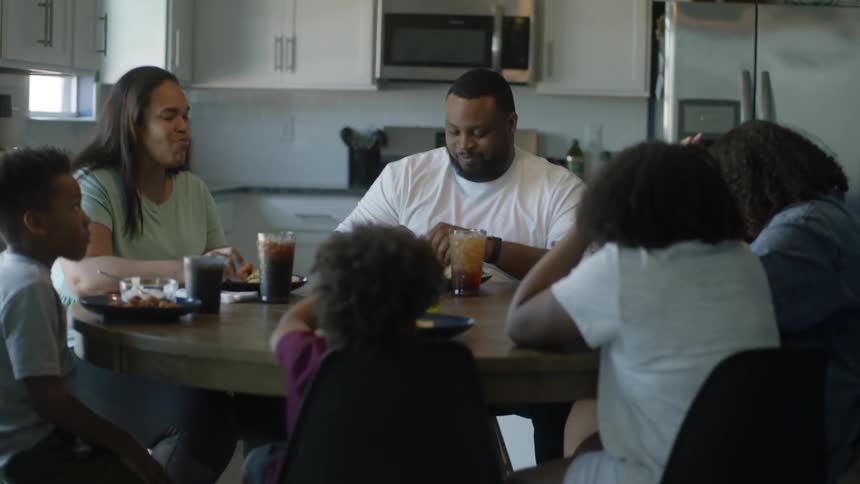 A family has a meal at home