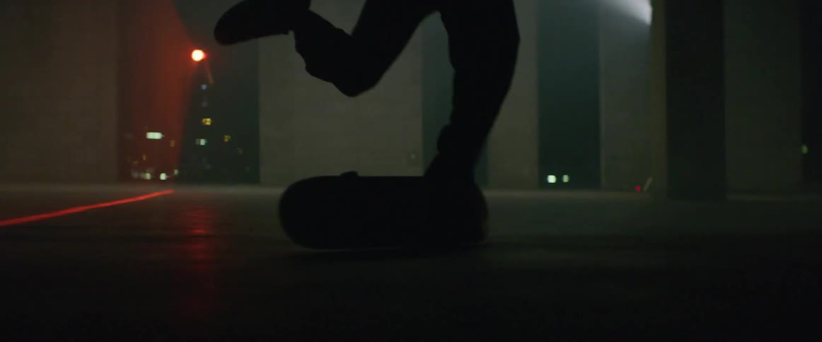 Skateboarder tries and fails to perform skateboard trick