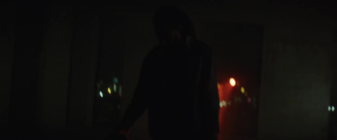 A man spins his skateboard on the ground