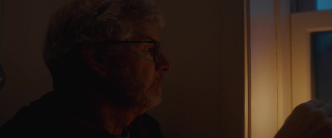 A man lights is lamp and puts the lid on