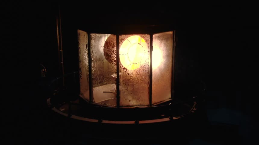 Electric lighthouse beacon rotates at night