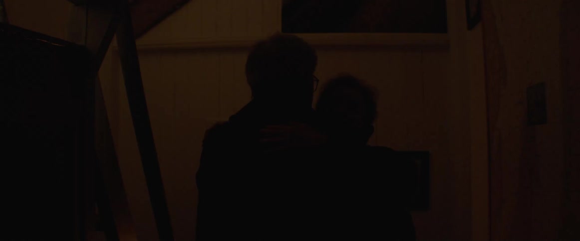 Rotating beacon lights area as older couple dances