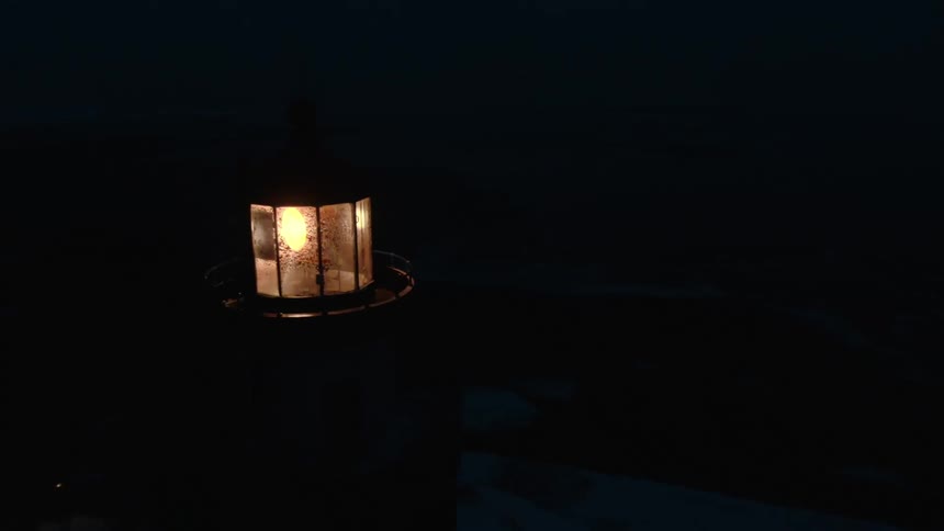 A beam of light spins around in a lighthouse