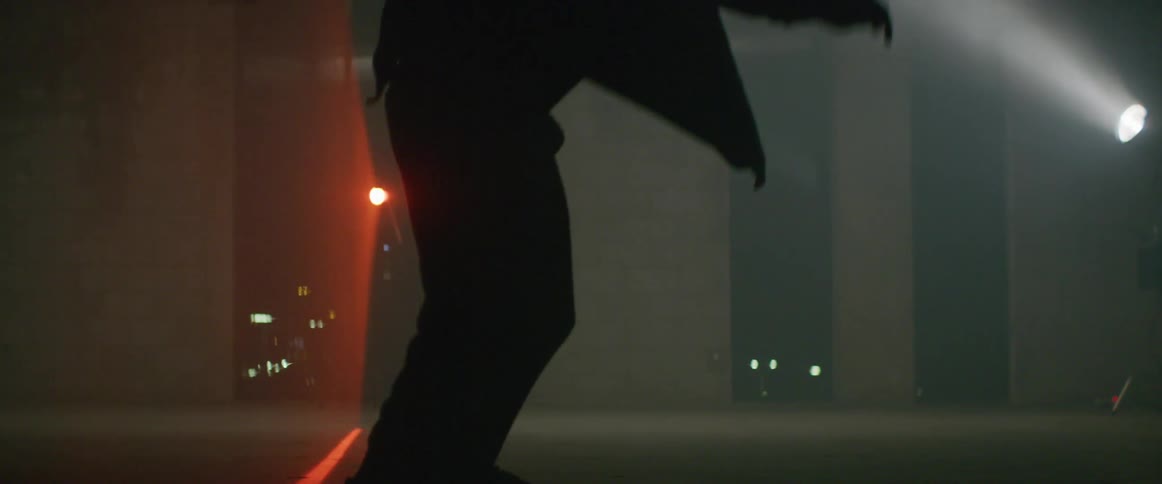 A man does a jump on his skateboard