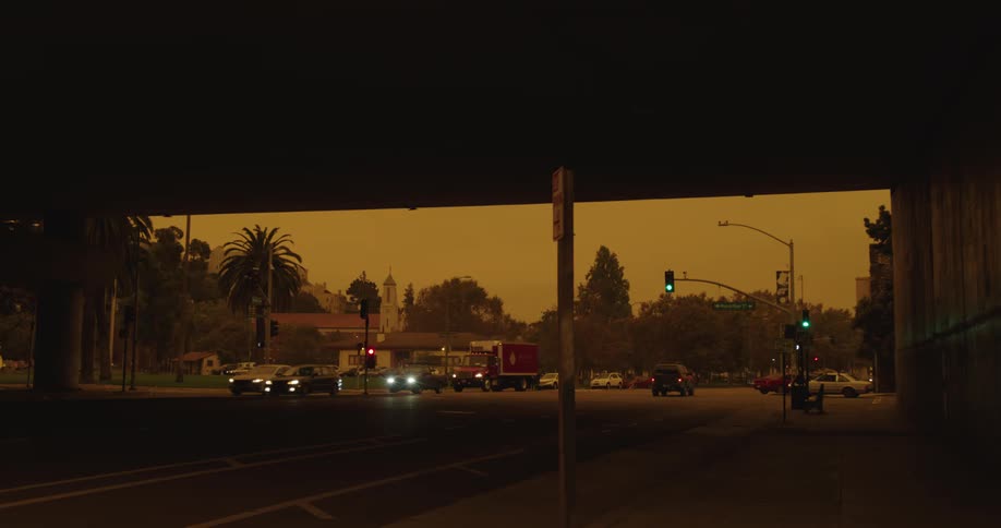 Traffic runs down the road under the overpass