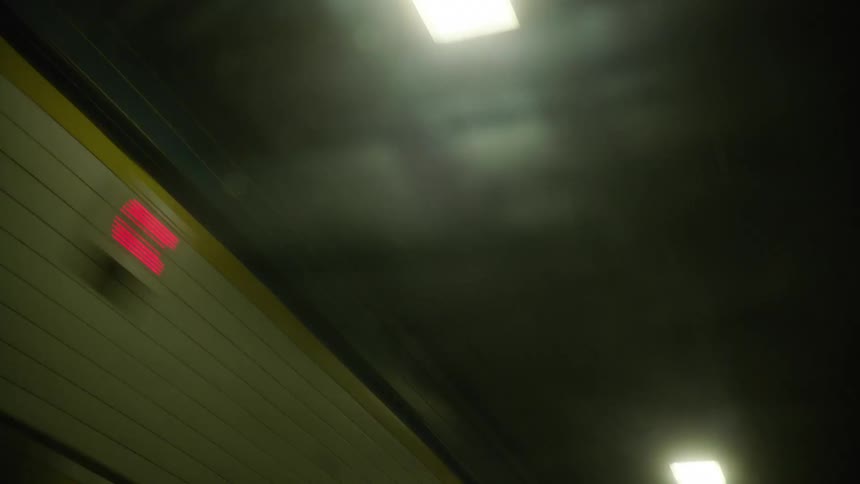 Speeding through a tunnel ceiling with led lights
