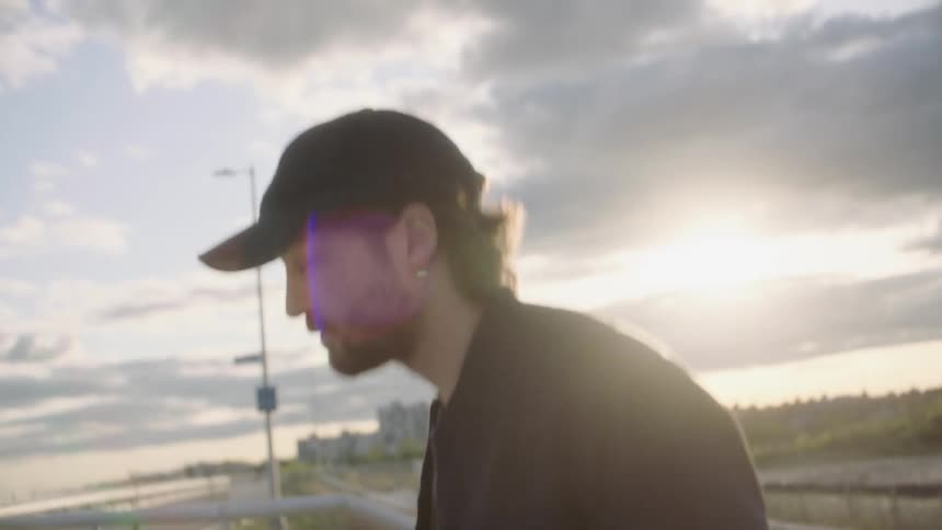 A man walks over the overpass
