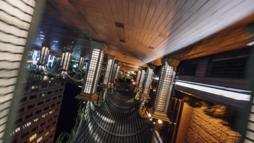 A tunnel with lights in a city at night