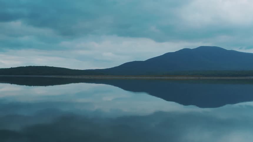 The mountains reflect on the water