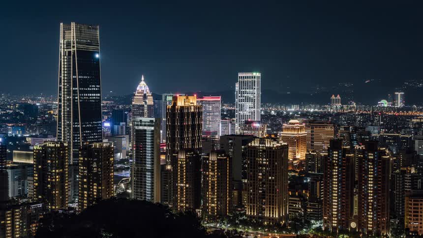 Time lapse view of a downtown city is displayed at night