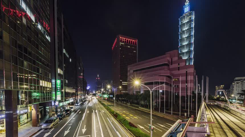 Time lapse view of cars driving through a city at night