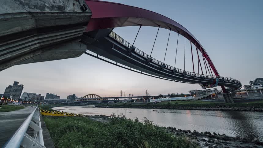 Time lapse view of pedestrians walking near a river