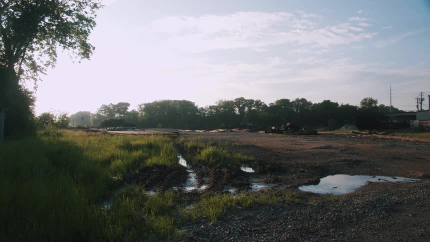 Muddy rain puddles in a rural area on a summer day