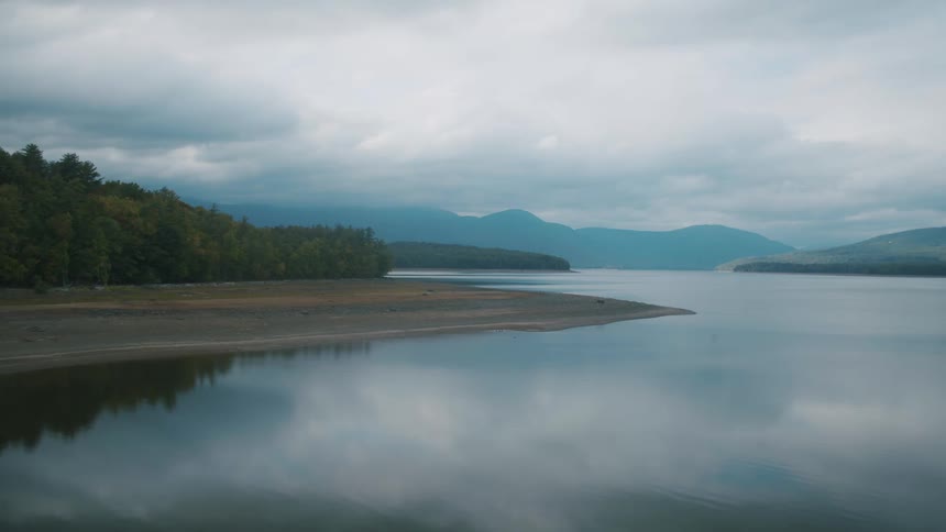 Clouds floating above a calm lake in nature on an overcast day
