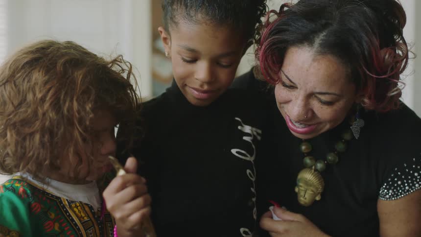 Mother teaches her daughter how to cook