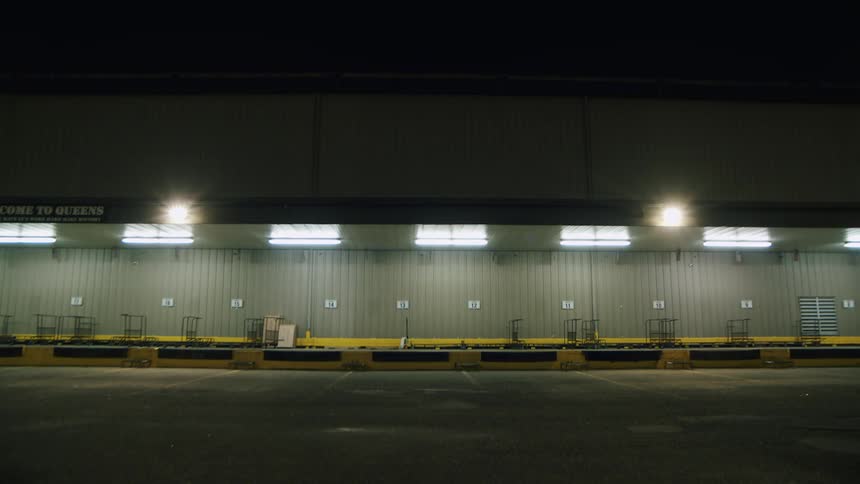 The parking lot is empty at night