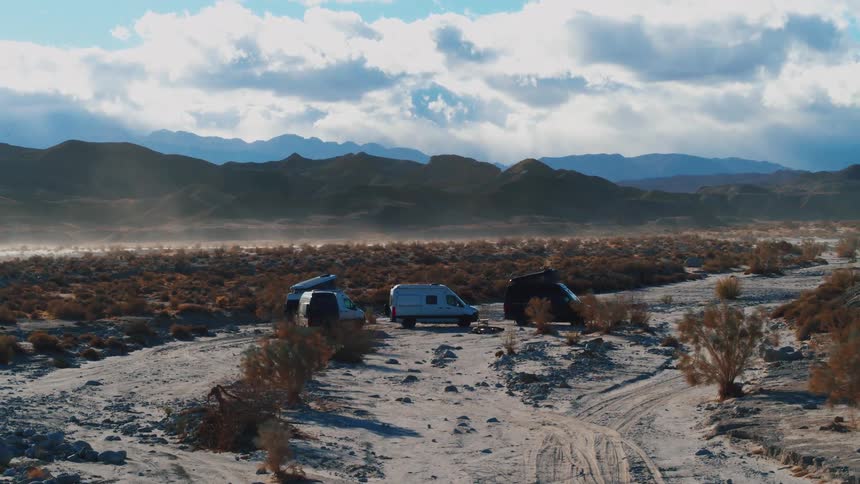 An aerial view of camping vans outdoors