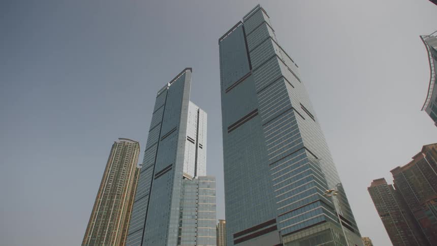 Twin skyscrapers tower over other downtown buildings
