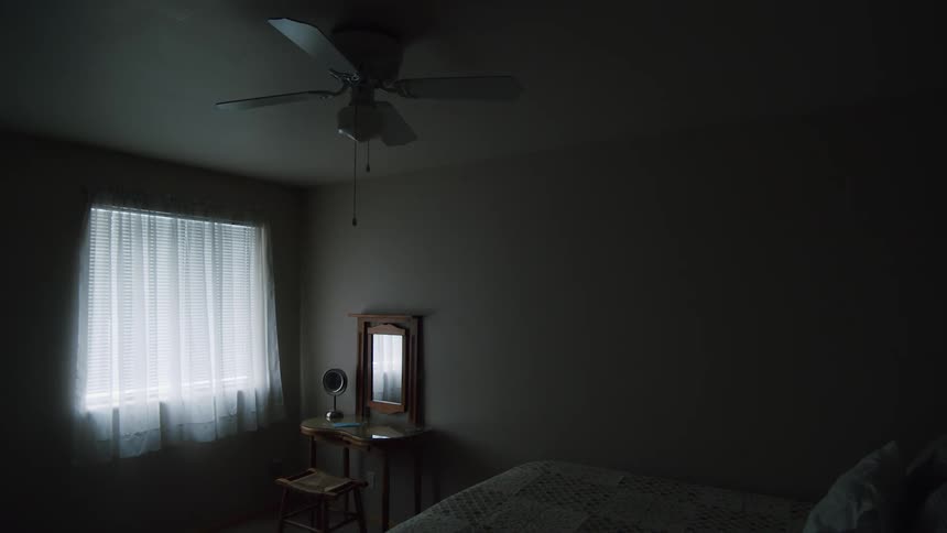 Interior view of bedroom with mirrors curtains and blinds