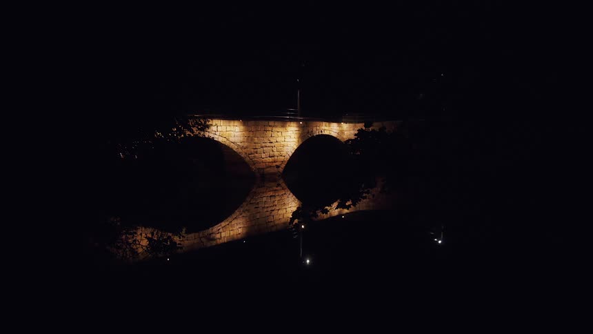 The bridge is lit at night