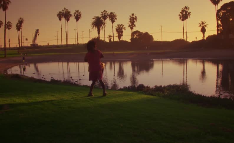 A man and woman dancing outdoors