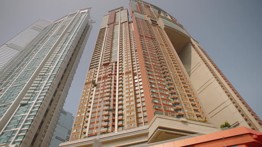 Mirrored windows on a skyscraper glimmer in sunlight